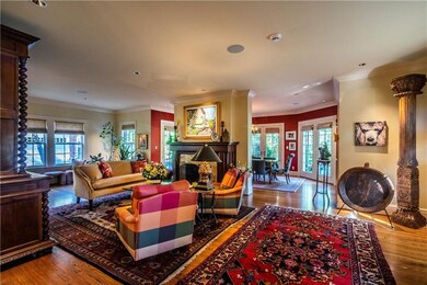 View of living room from entry.  Fireplace, open t