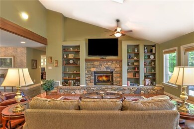 Lofty great room with stone fireplace
