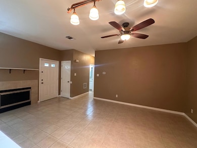 Unfurnished living room featuring light tile patt