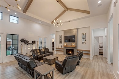 This spacious living room features high ceilings w
