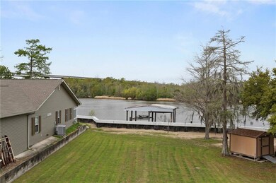 Rear View of Water Frontage and Covered Dock