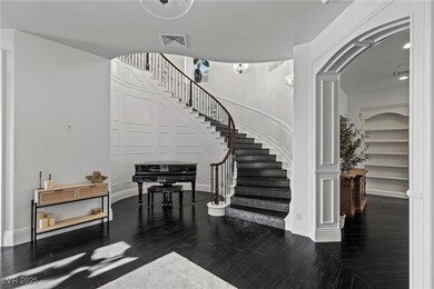Foyer entrance with stairs, visible vents, a decor