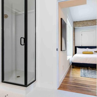Unfurnished bedroom featuring hardwood / wood-styl