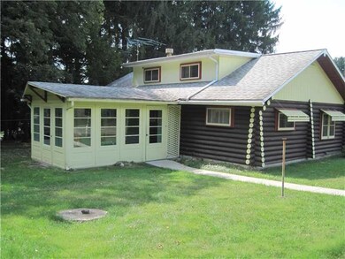 Exterior Back. 9x15 sun room, great for summer gat