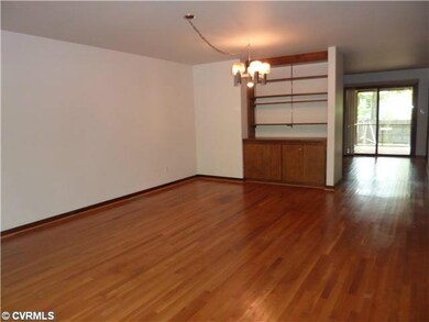 Living Room - Gleaming hardwoods with built-in boo