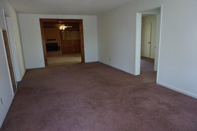 LIVING ROOM FROM FRONT ENTRY DOOR, BED ROOMS TO RI