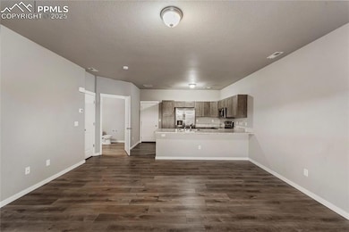 Kitchen with light countertops, stainless steel ap