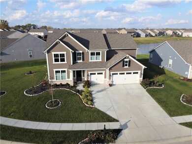 The three car garage offers plenty of storage options and the large driveway provides plenty of parking space.