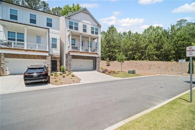 View of front of house featuring concrete driveway
