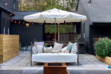 You're looking at the back patio and one of two firepits. You can also see the terraced planters.