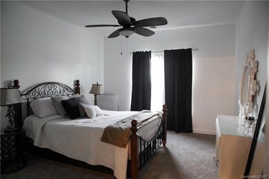 master bedroom with walk in closet