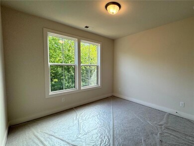 Spare room featuring baseboards