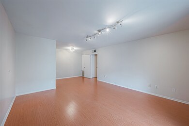 Living room is 15.7 x14.4 and has engineered wood
