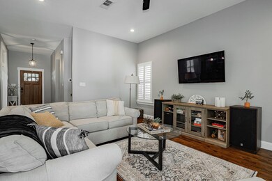 Living room with dark hardwood / wood-style floors