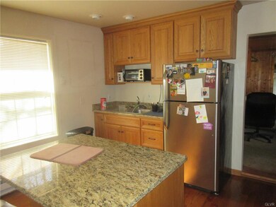 Update kitchen addition with hardwood, GFCI, Grani
