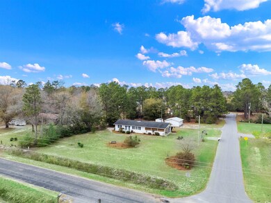 Birds eye view of property featuring a rural view