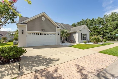 View of front of home with a garage and central ai