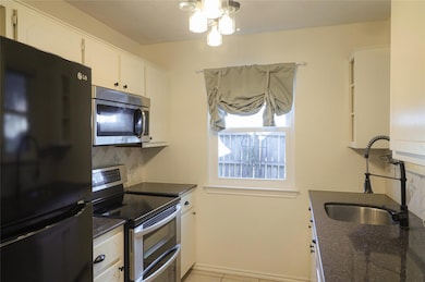 Kitchen featuring appliances with stainless steel