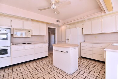 Kitchen with white appliances.