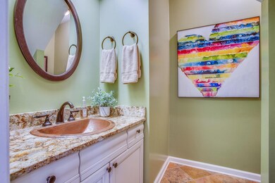 MAIN FLOOR POWDER ROOM:New vanity,  Copper sink, Oil rubbed bronze faucets/ hardware , Tile flooring,