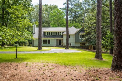 Exterior space featuring a front lawn