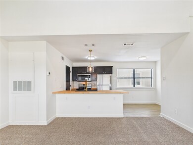 Kitchen featuring appliances with stainless steel