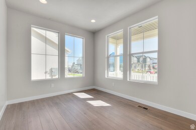 Unfurnished room featuring light wood-style flooring and recessed lighting