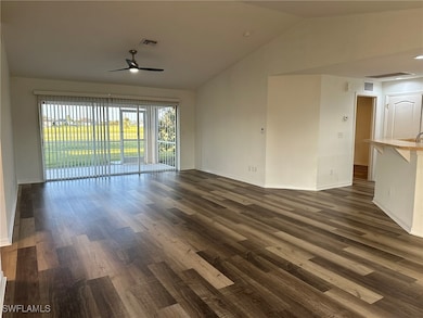 Unfurnished living room with dark hardwood / wood-