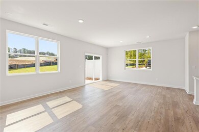 Unfurnished room featuring baseboards, light wood-type flooring, and recessed lighting