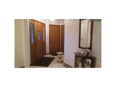 Spacious foyer with guest closet