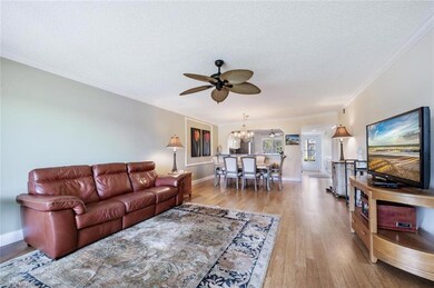 Living room featuring ornamental molding, ceiling 
