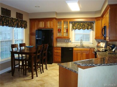 Beautiful cooks kitchen with granite and cherry.