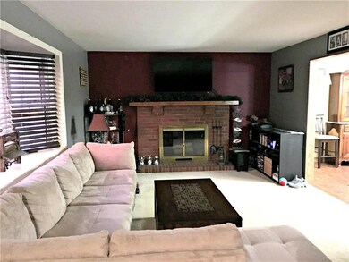 Spacious living room features both a fireplace and