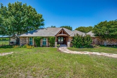 Ranch-style home featuring a front yard