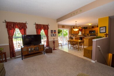 View looking into kitchen and stairway leading to 