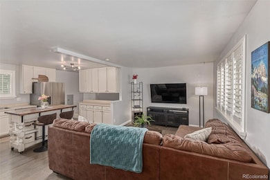 Open main level showcases beautiful floors and smooth ceilings for a bright stylish look.