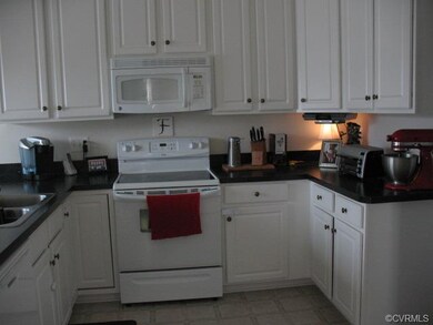 Bright kitchen with new dishwasher, flat surface r
