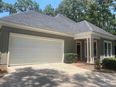 View of side of home featuring a garage