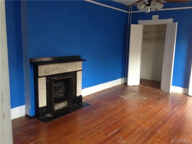 LIVING ROOM IN DOWNSTAIRS UNIT.