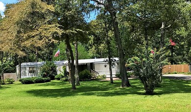 Manicured front with sprinkler system.