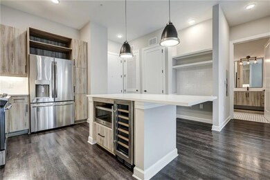 Kitchen with pendant lighting, wine cooler, stainl