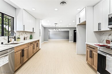 Kitchen featuring stainless steel appliances, ligh