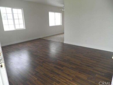 Open front room with lots of natural light.