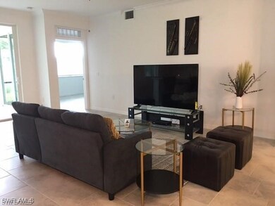 Living room featuring a healthy amount of sunlight and light tile patterned floors