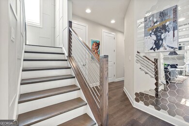 Stairwell brightened with large window and custom trimwork