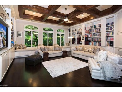 Family / Media Room with Acacia wood flooring