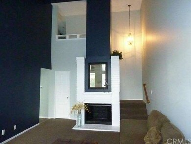Another view of living room with coat closet to th