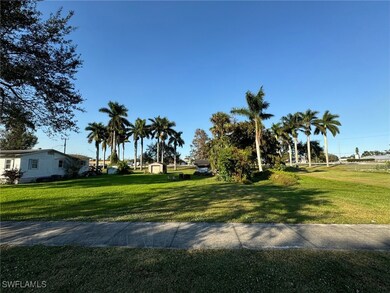View of property's community with a yard