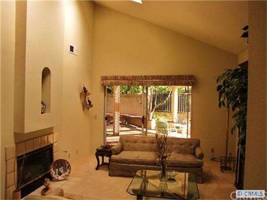 Living room has skylight and vaulted ceiling