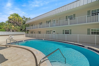 Apt 102 B overlooks the heated community pool